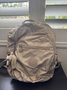 Kipling Metallic Champagne Backpack with Monkey Keychain